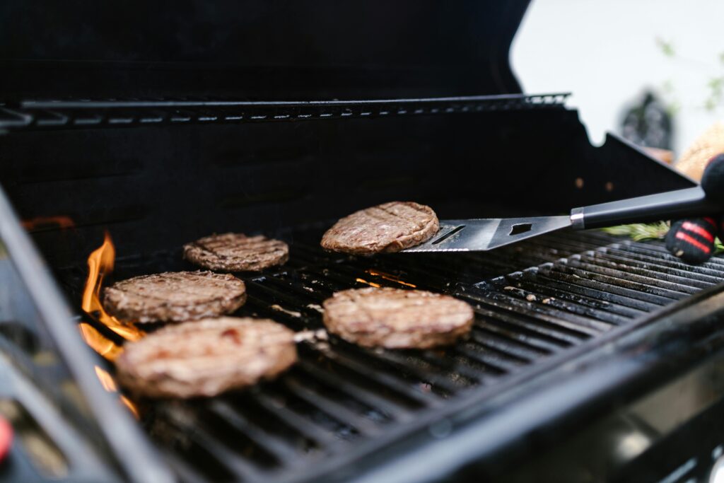grilling burgers with essential BBQ tool guide Canada