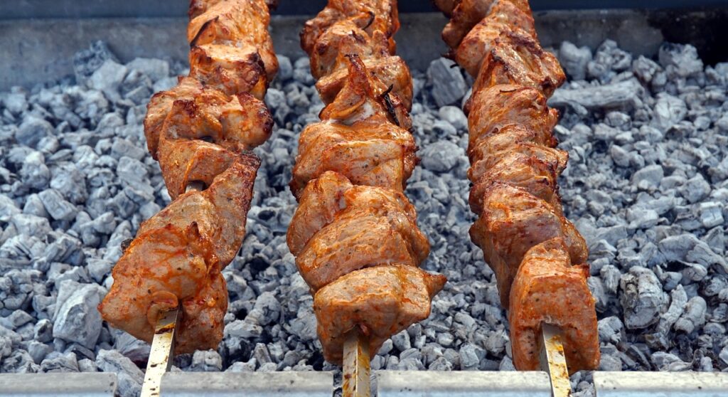 kebabs on grill coals for festive outdoor entertaining